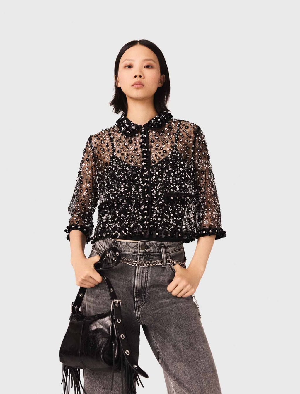 Polo strassé à motif floreal