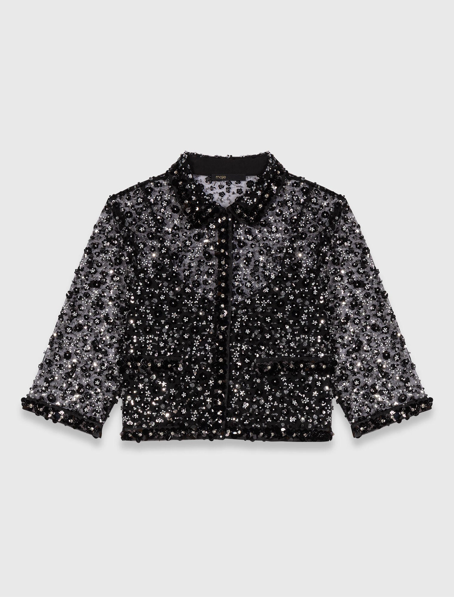 Polo strassé à motif floreal